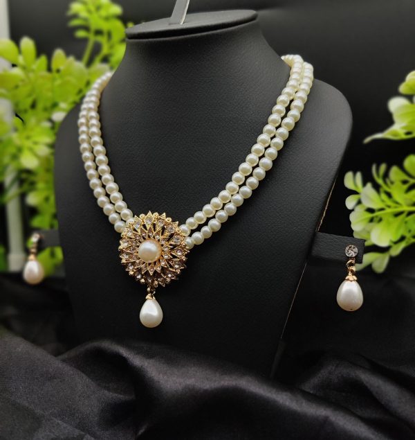 Double-Layered Pearl Necklace with Golden Sunburst Pendant